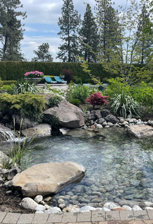 Paver walkway and planted beds installed by Elite Hardscapes in Spokane