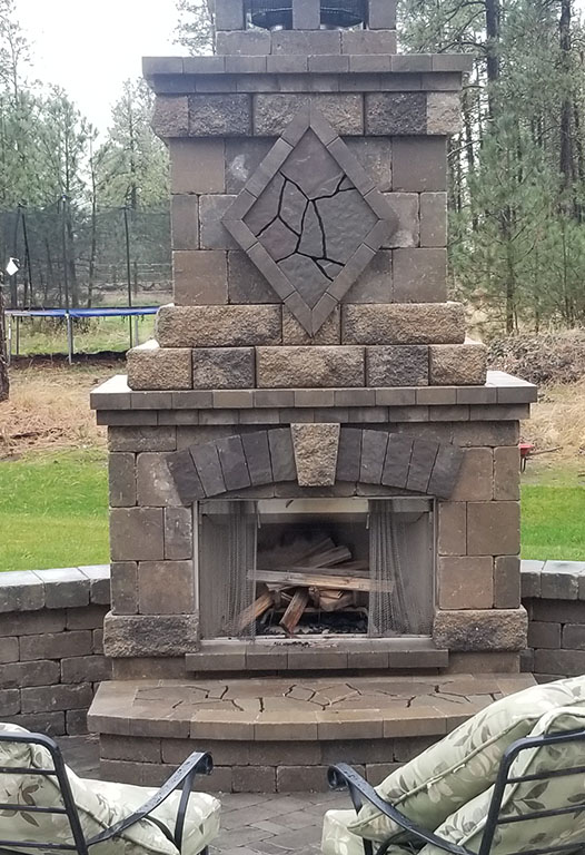 Interlocking paver patio and seat wall installed by Elite Hardscapes in Spokane, WA