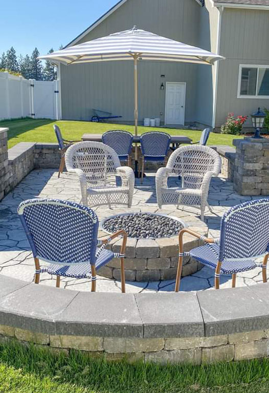 Paver patio and planted garden beds built by Elite Hardscapes in Spokane, Washington