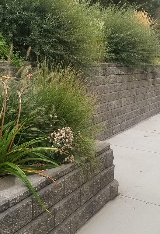 Segmental block retaining wall with terraced planting beds built by Elite Hardscapes in Spokane, WA