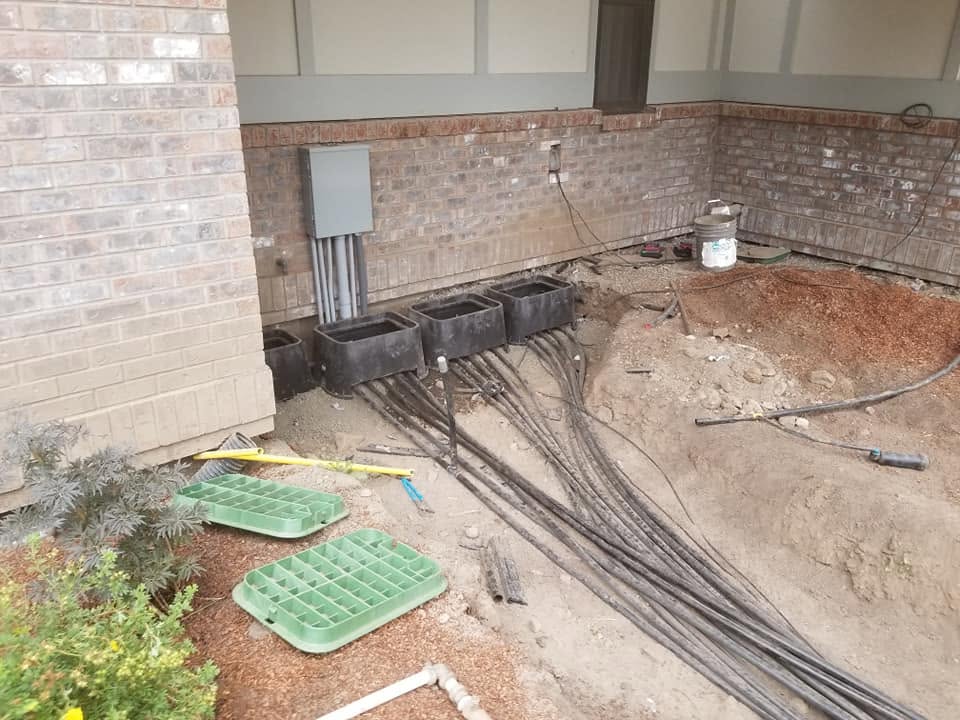 Irrigation valve boxes and manifold serviced by Elite Hardscapes on a Spokane property